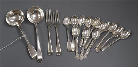 A George III beaded Old English pattern silver sauce ladle, a Victorian fiddle pattern sauce ladle, two dessert forks,